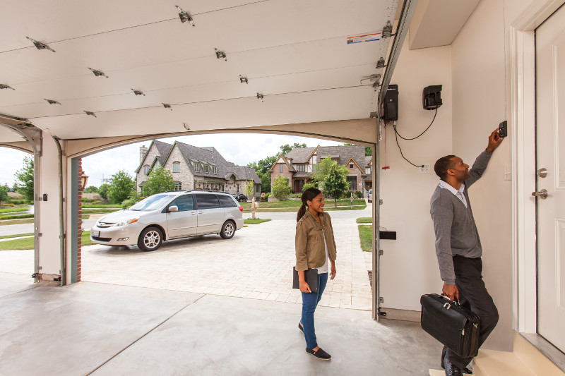 Homeowners-opening-garage-door